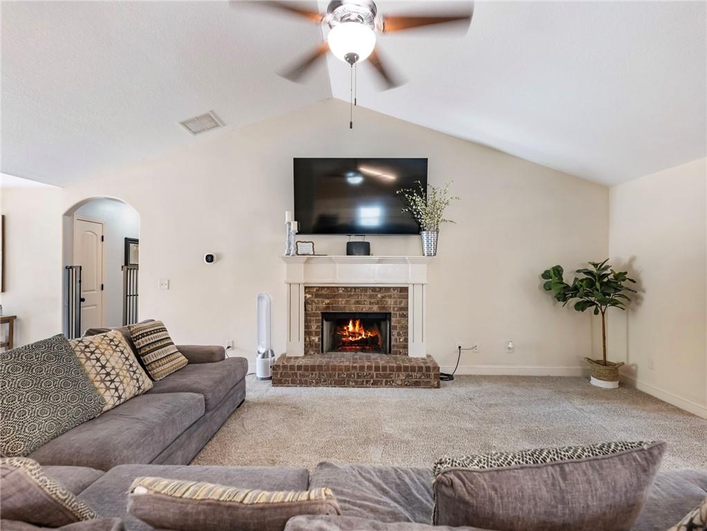 476 River Mist Circle Jefferson, GA 30549 - Photo 4 of 44 a living room with furniture a fireplace and a flat screen tv