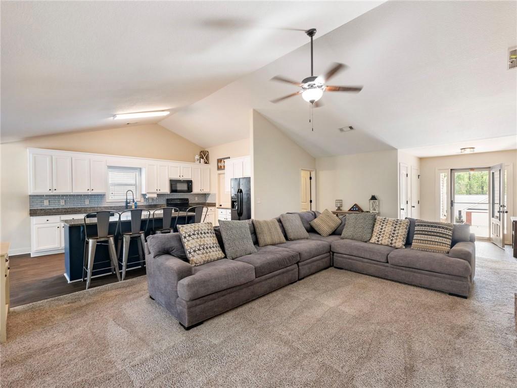 476 River Mist Circle Jefferson, GA 30549 - Photo 5 of 44 a living room with furniture kitchen view and a chandelier