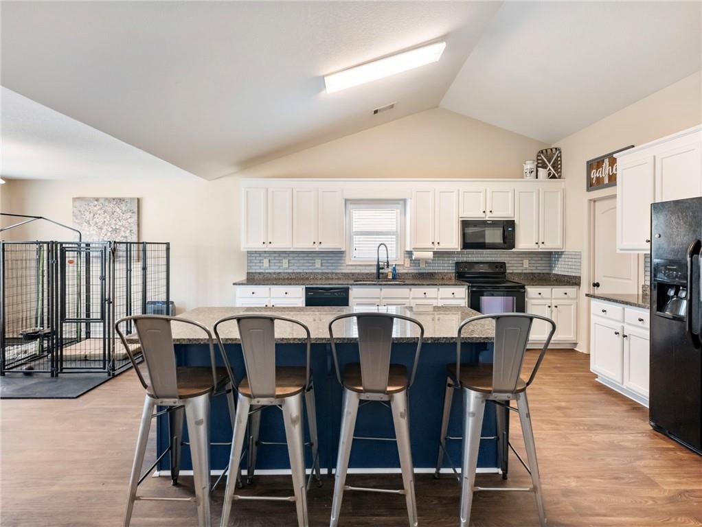 476 River Mist Circle Jefferson, GA 30549 - Photo 6 of 44 a view of a dining room with furniture and wooden floor