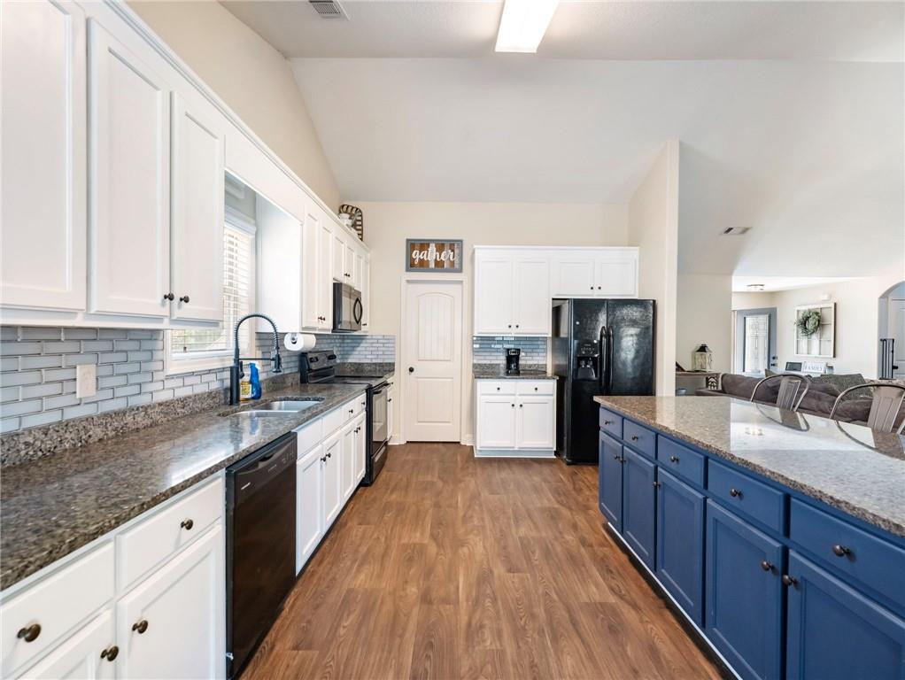 476 River Mist Circle Jefferson, GA 30549 - Photo 10 of 44 a large kitchen with stainless steel appliances sink a microwave and cabinets