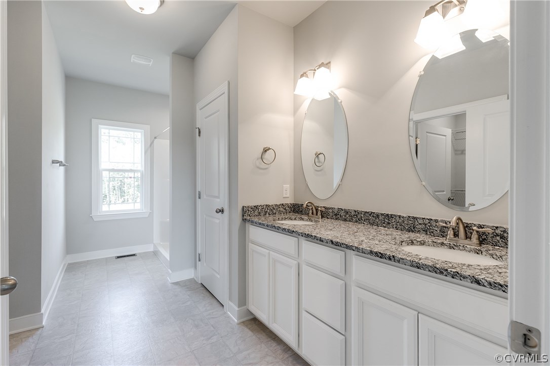 90 Hickory Ridge Circle Mineral, VA 23117 - Photo 13 of 23 a bathroom with a granite countertop double vanity sink and a mirror