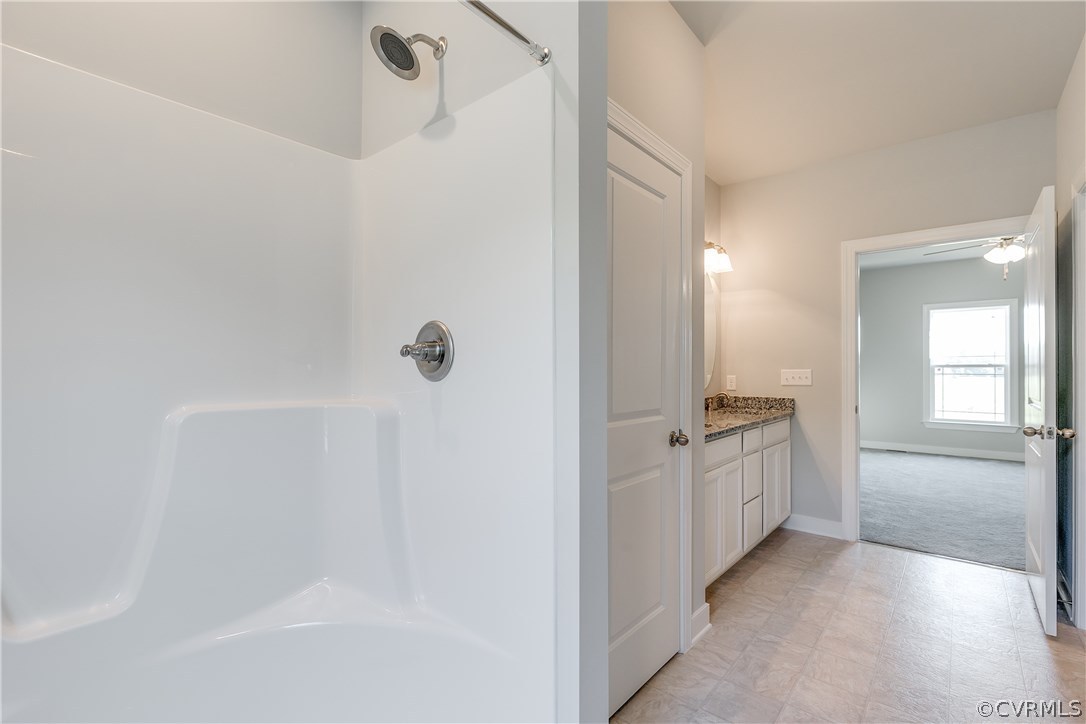 90 Hickory Ridge Circle Mineral, VA 23117 - Photo 14 of 23 a spacious bathroom with a granite countertop sink a mirror and a bathtub