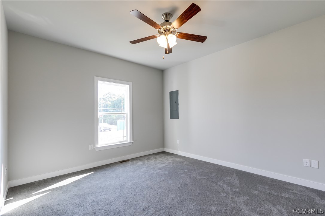 90 Hickory Ridge Circle Mineral, VA 23117 - Photo 17 of 23 an empty room with windows and chandelier fan