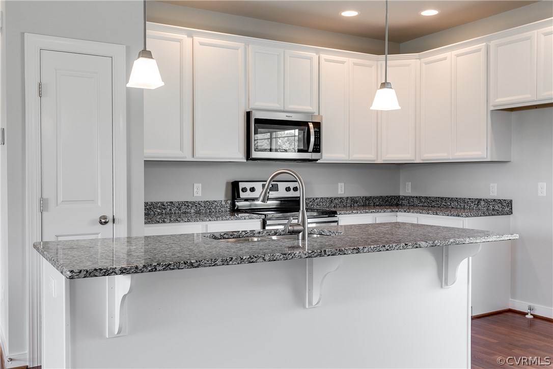 90 Hickory Ridge Circle Mineral, VA 23117 - Photo 6 of 23 a kitchen with stainless steel appliances granite countertop a sink a stove and a granite counter tops