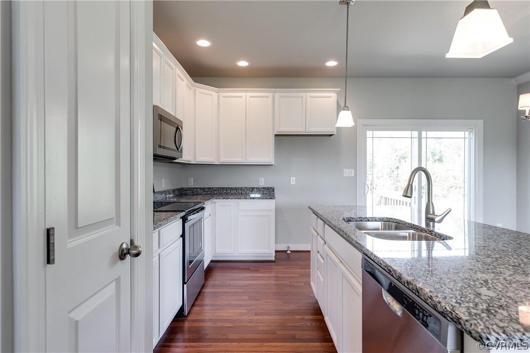 90 Hickory Ridge Circle Mineral, VA 23117 - Photo 9 of 23 a kitchen with stainless steel appliances granite countertop a sink stove and refrigerator