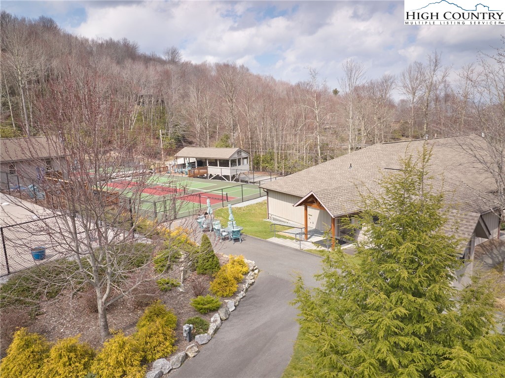 217 Overbrook Trail Beech Mountain, NC 28604 - Photo 13 of 16 a view of a swimming pool with an outdoor space and seating area