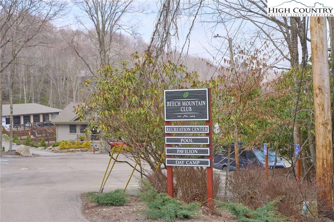 217 Overbrook Trail Beech Mountain, NC 28604 - Photo 14 of 16 a pathway of a house with a yard and large trees