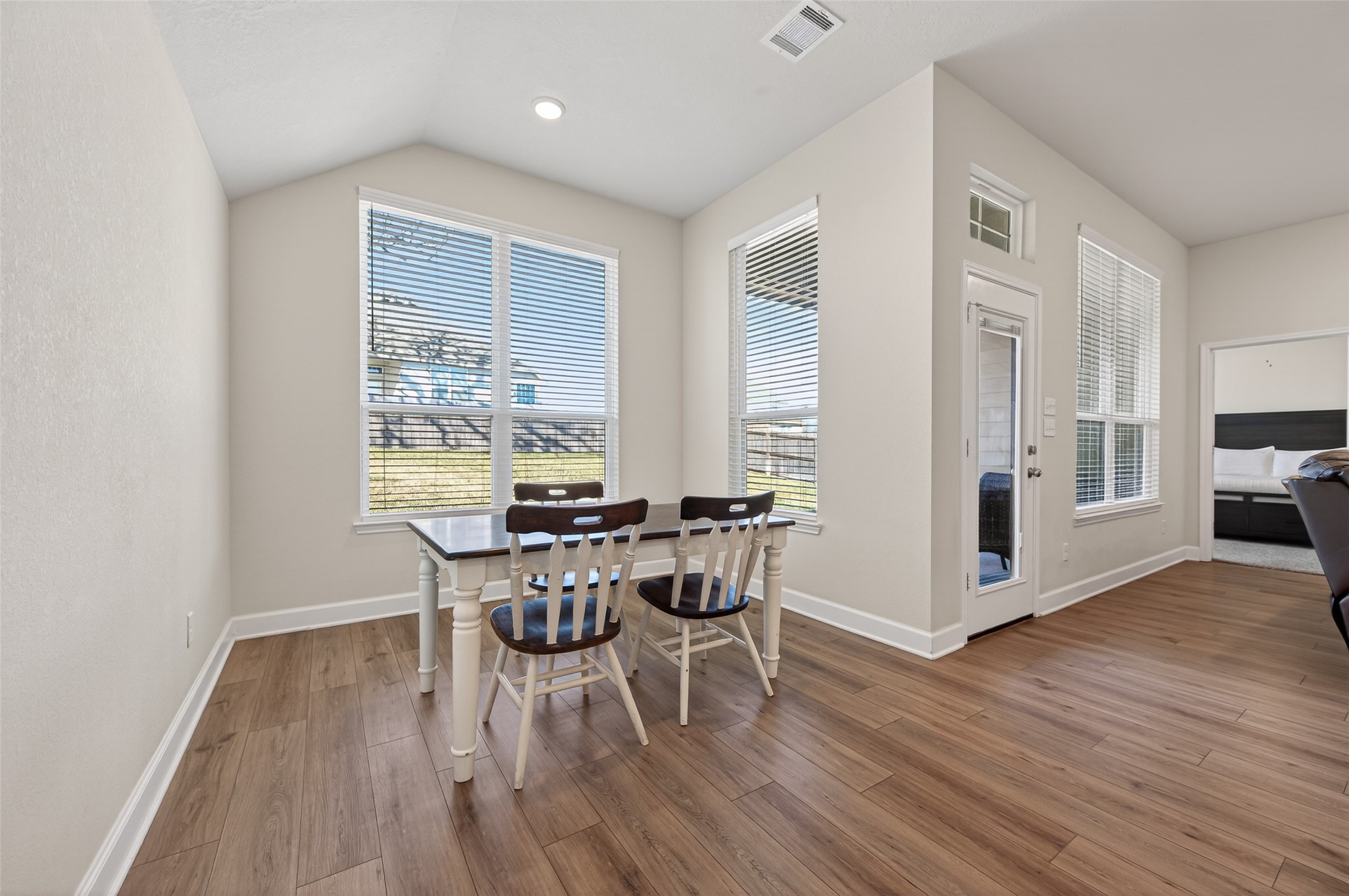 917 Farm Path Brenham, TX 77833 - Photo 19 of 43 a view of a dining room with furniture and wooden floor