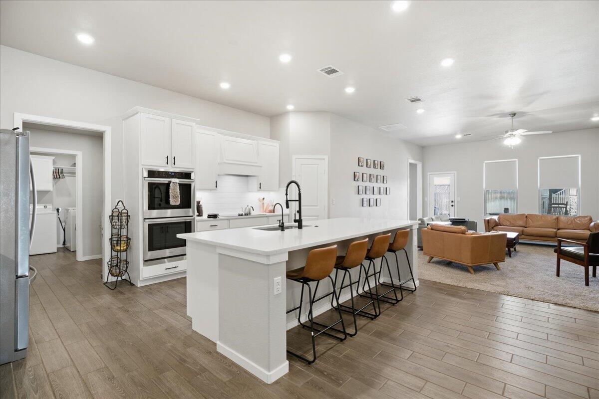 9807 Virginia Avenue Lubbock, TX 79424 - Photo 12 of 39 a large room with stainless steel appliances lots of counter space and furniture