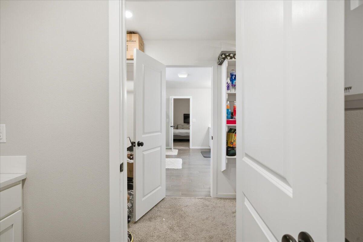 9807 Virginia Avenue Lubbock, TX 79424 - Photo 32 of 39 a view of a hallway with wooden floor and staircase