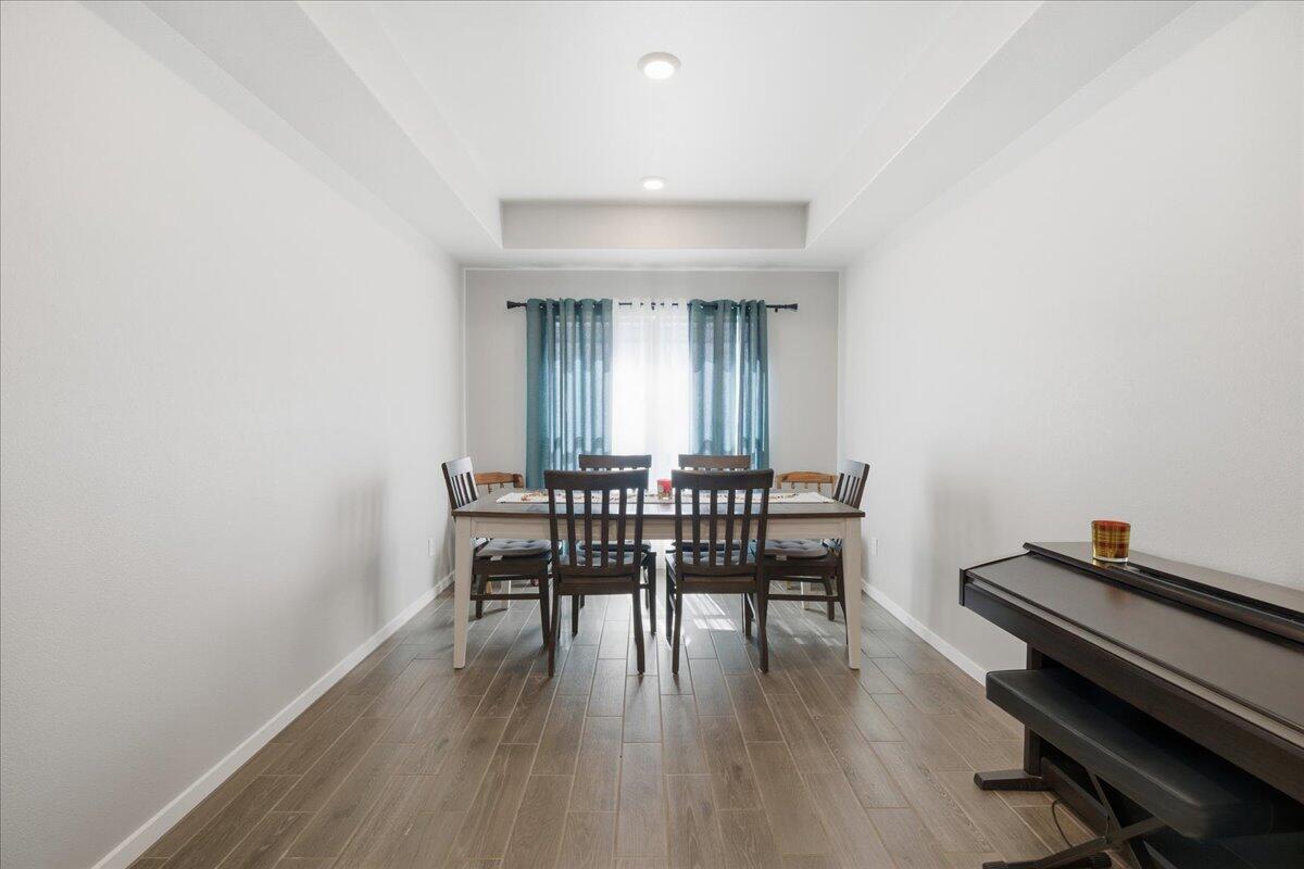 9807 Virginia Avenue Lubbock, TX 79424 - Photo 9 of 39 a dining room with furniture and wooden floor