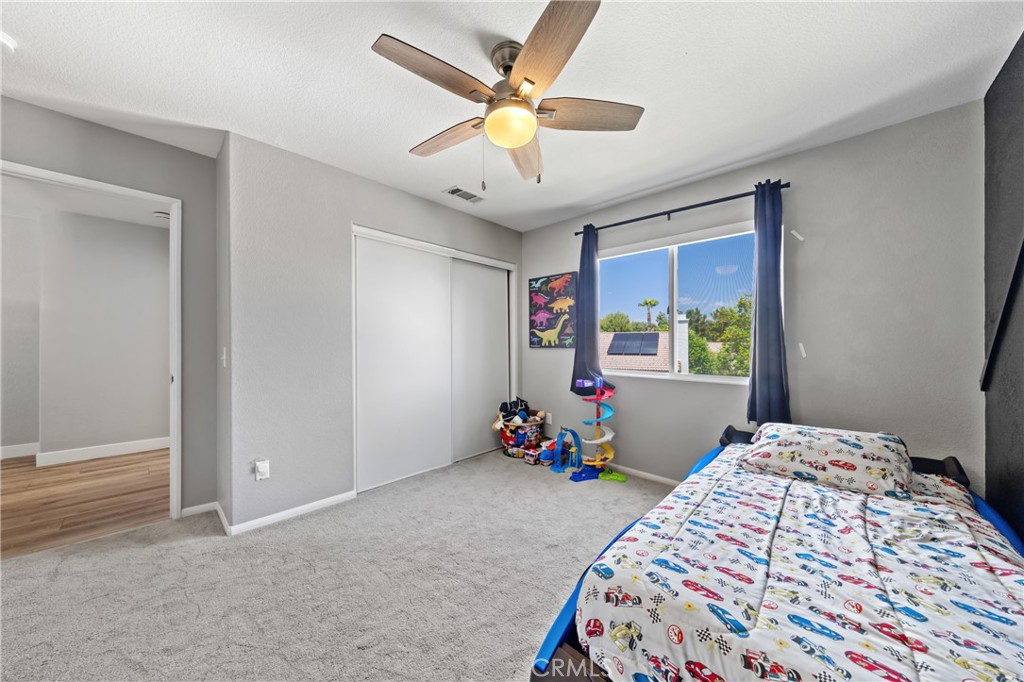 32985 Novara Court Temecula, CA 92592 - Photo 39 of 56 Bright Bedroom With Ceiling Fan And Scenic Window Views