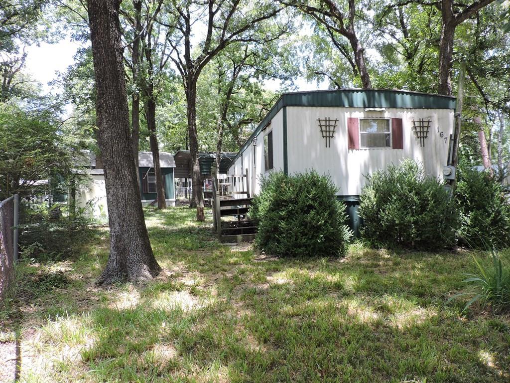 167 Bay Drive Mabank, TX 75156 - Photo 3 of 11 a view of a back yard with green space