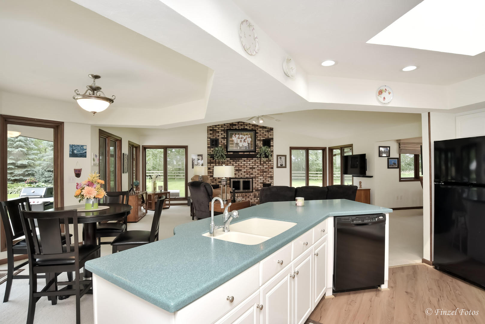 7405 Maxon Road Harvard, IL 60033 - Photo 11 of 30 a kitchen with a sink a counter and chairs