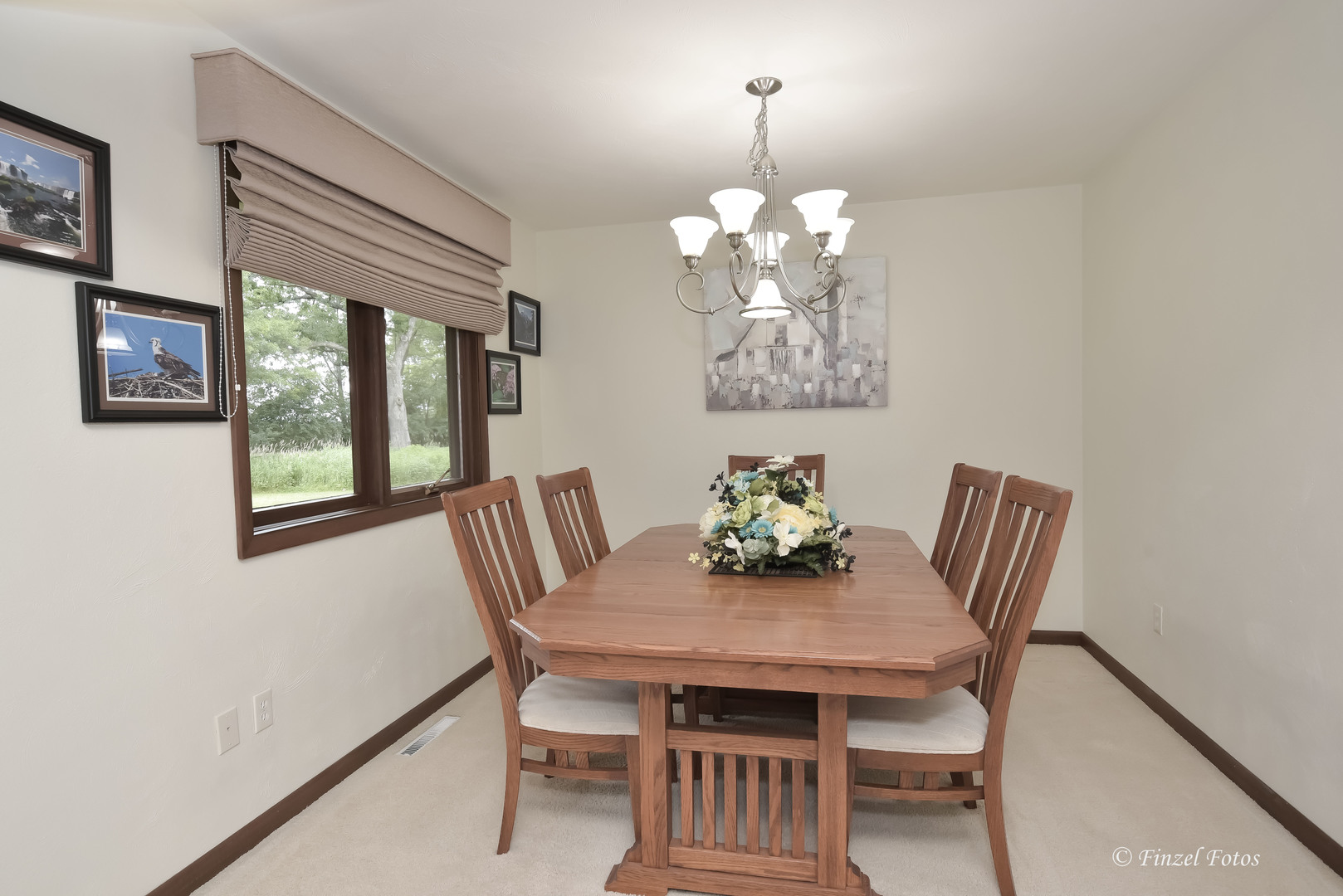 7405 Maxon Road Harvard, IL 60033 - Photo 12 of 30 a view of a dining room with furniture a chandelier and wooden floor