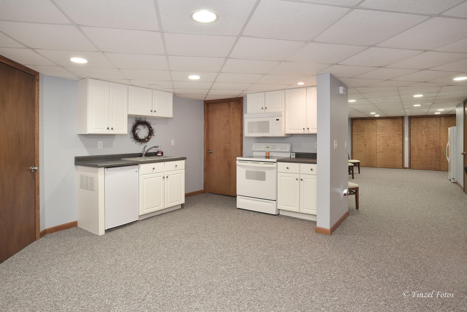 7405 Maxon Road Harvard, IL 60033 - Photo 21 of 30 a kitchen with a sink a stove cabinets and a refrigerator