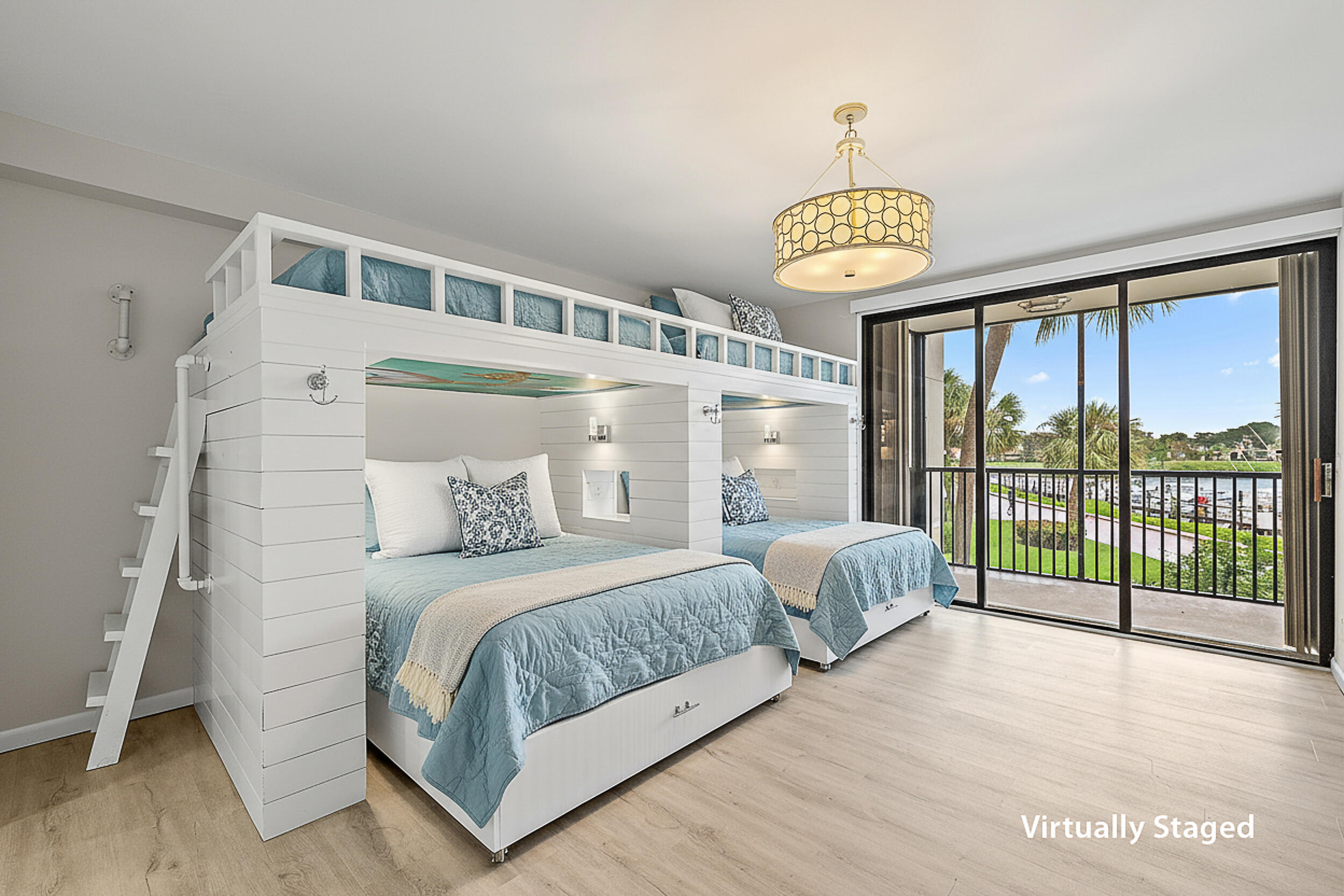 16910 Bay Street, Unit E204 Jupiter, FL 33477 - Photo 12 of 27 a bedroom with a bed and a window