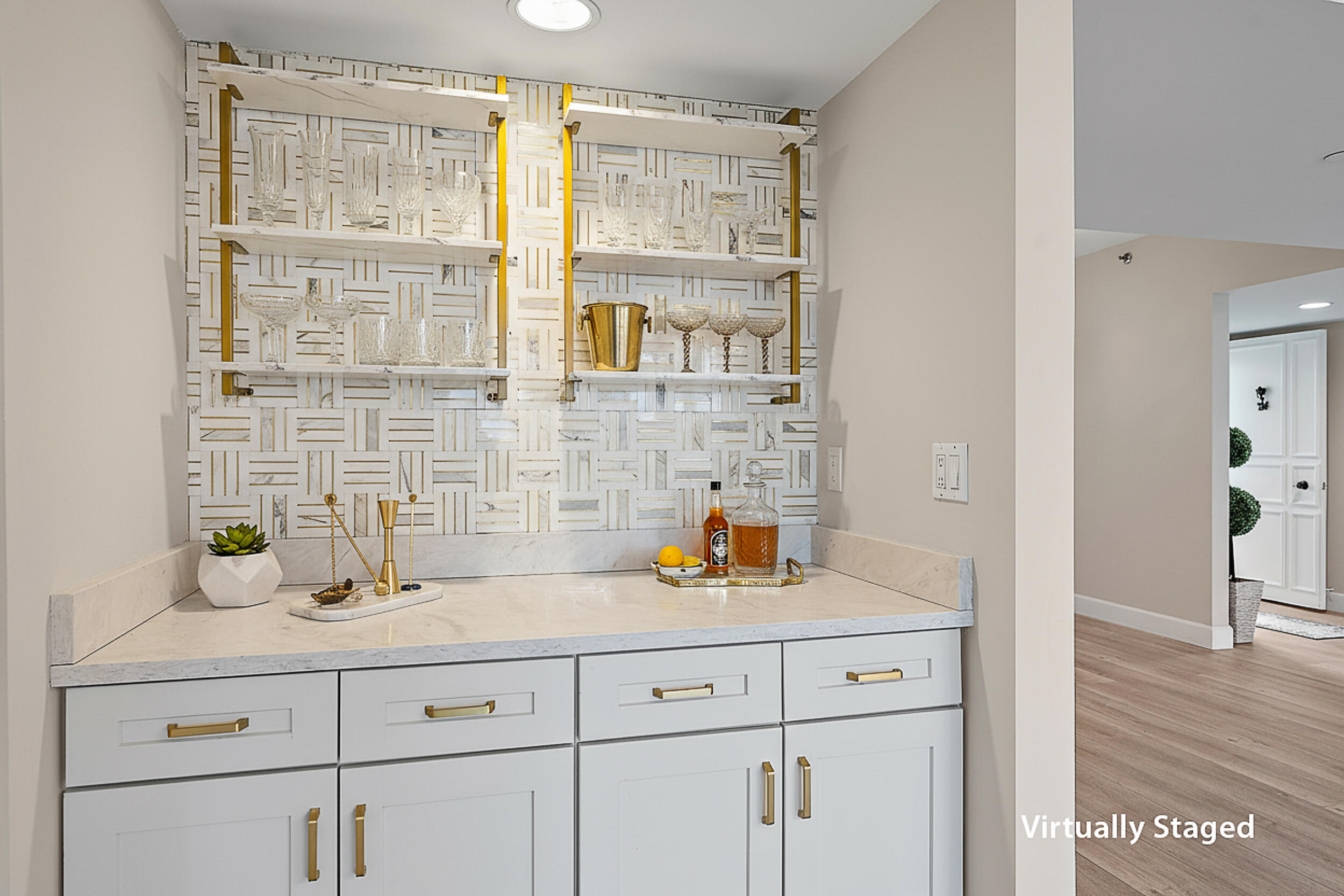 16910 Bay Street, Unit E204 Jupiter, FL 33477 - Photo 14 of 27 a kitchen with cabinets and wooden floor