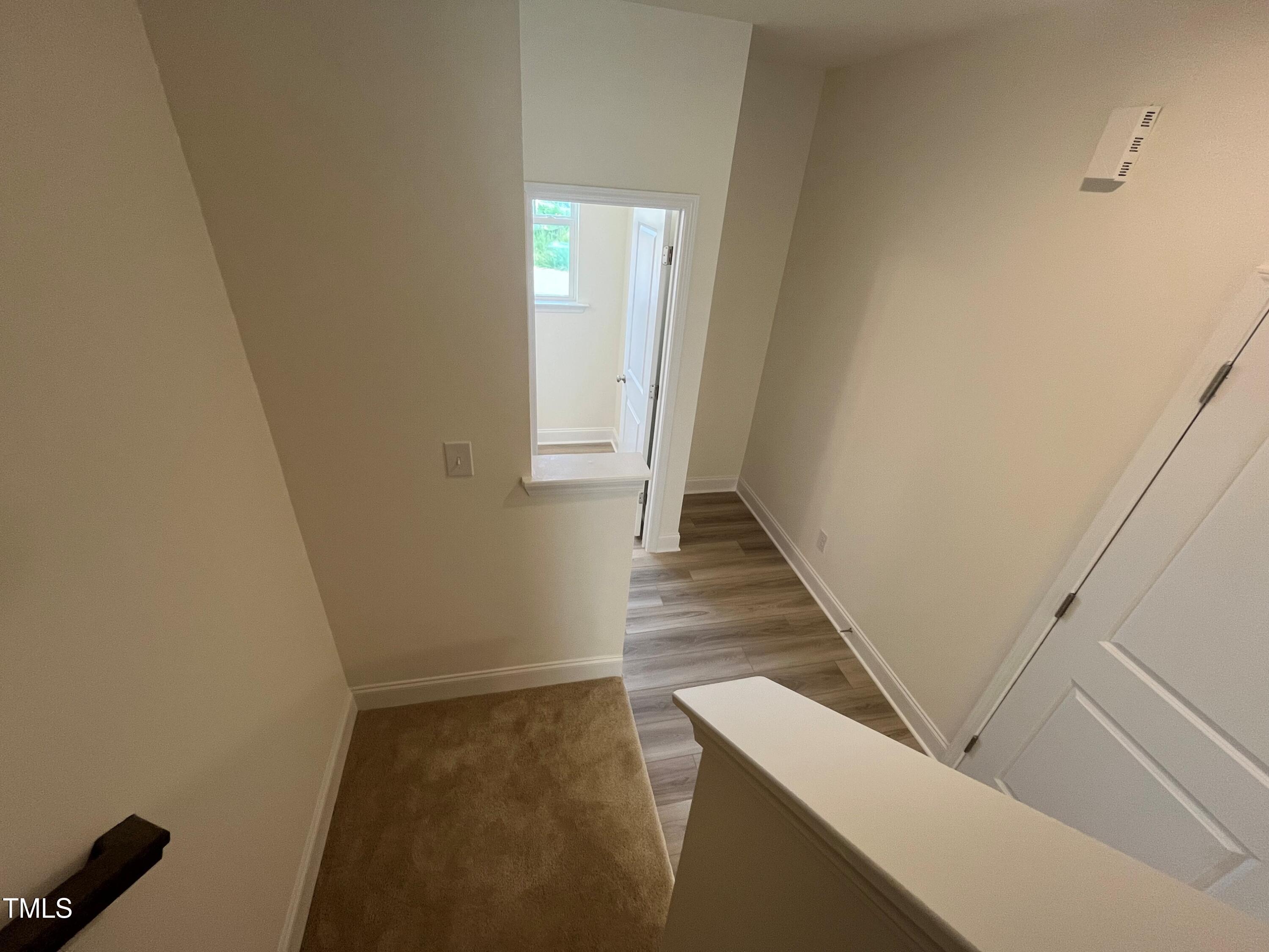 6129 Arsenal Avenue Raleigh, NC 27610 - Photo 16 of 34 Back staircase with storage area