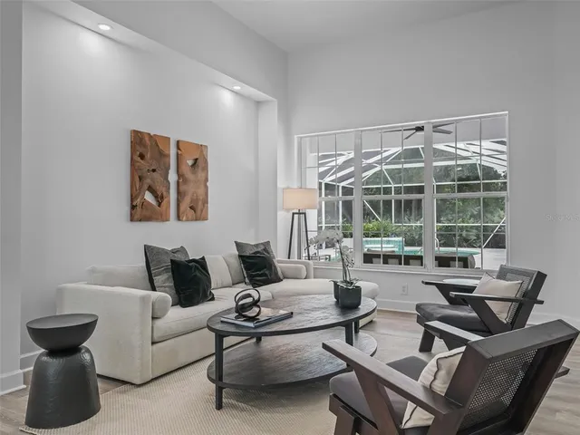 a dining room with furniture and window