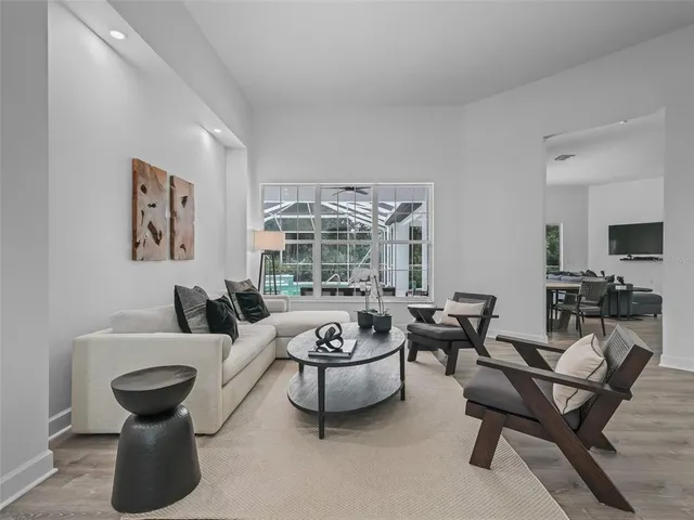 a view of a dining room with furniture window and wooden floor