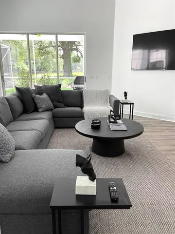 a spacious bedroom with a bed and a window