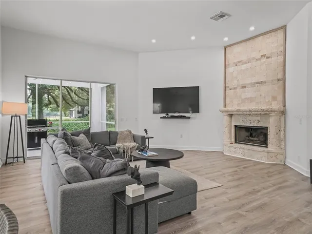 a spacious bedroom with a bed and a table