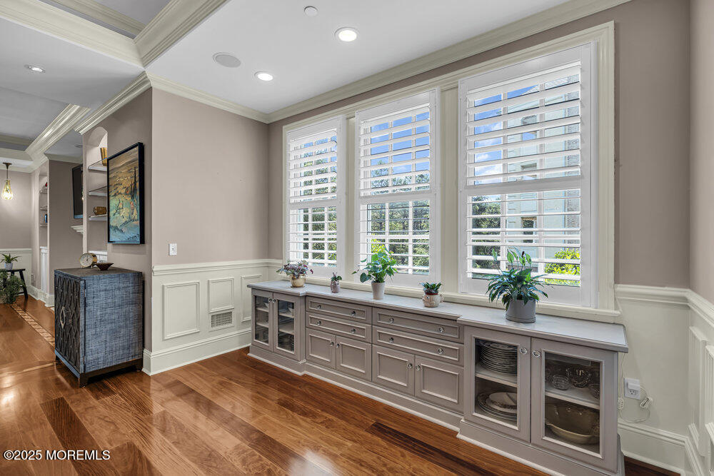 1222 Oval Road Manasquan, NJ 08736 - Photo 26 of 77 a view of a kitchen with stainless steel appliances wooden floor and a large window