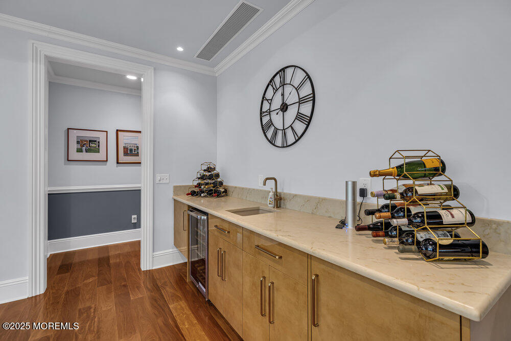 1222 Oval Road Manasquan, NJ 08736 - Photo 38 of 77 a kitchen with a sink and a stove