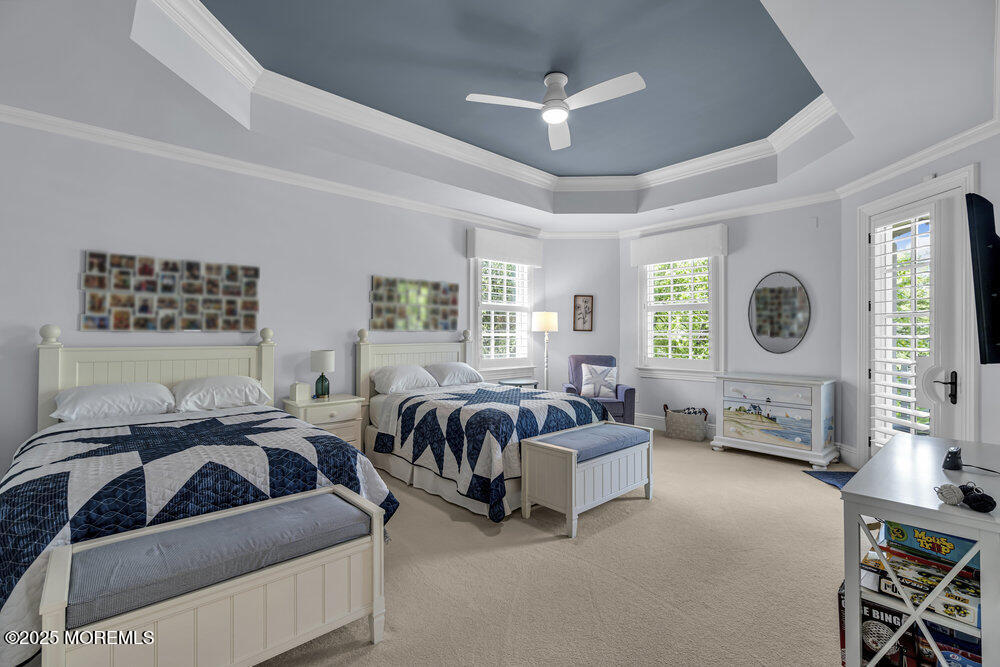 1222 Oval Road Manasquan, NJ 08736 - Photo 50 of 77 a bedroom with furniture and a large window