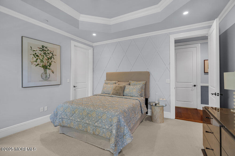 1222 Oval Road Manasquan, NJ 08736 - Photo 56 of 77 a bedroom with a bed and a couch