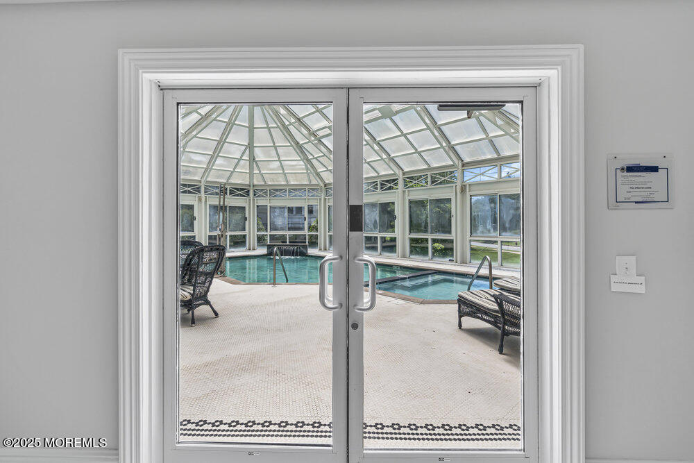 1222 Oval Road Manasquan, NJ 08736 - Photo 77 of 77 view of living room with furniture and floor to ceiling window