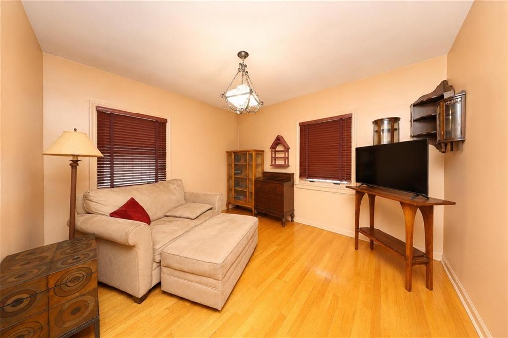 1 Bay Ridge Parkway Brooklyn, NY 11209 - Photo 21 of 38 a living room with furniture and a flat screen tv