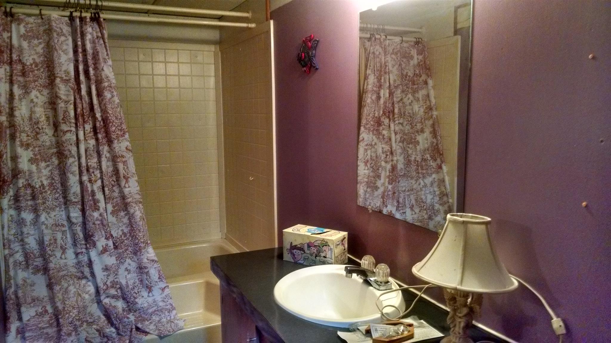 1535 Maddox Road Centerville, TN 37033 - Photo 8 of 26 a bathroom with a sink toilet and shower