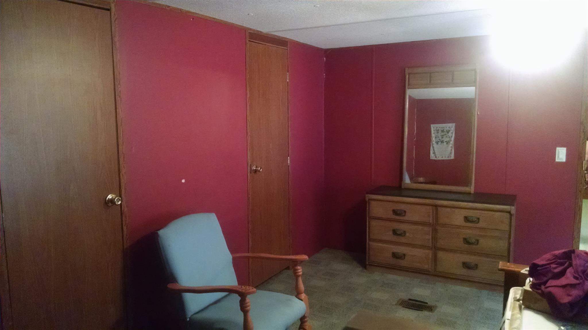 1535 Maddox Road Centerville, TN 37033 - Photo 9 of 26 a room with a chair and dresser