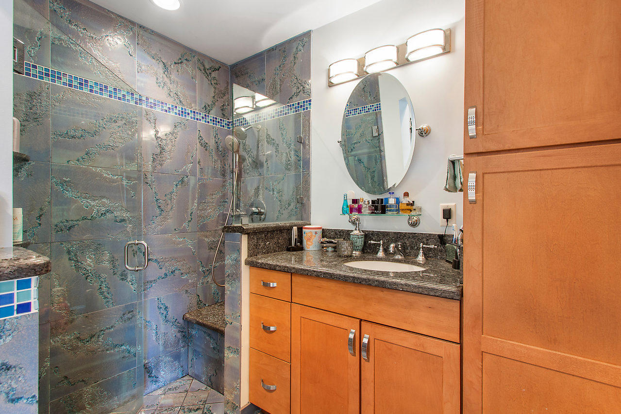 22045 Aquila Street Boca Raton, FL 33428 - Photo 17 of 24 a bathroom with a sink vanity mirror and tub