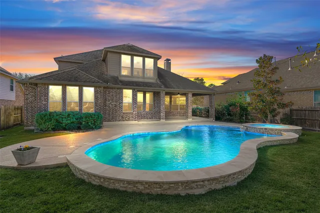 a view of a swimming pool with a patio