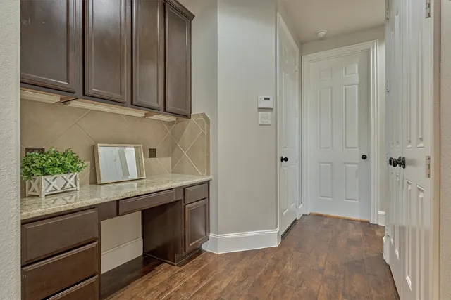 a view of a kitchen with electric appliances