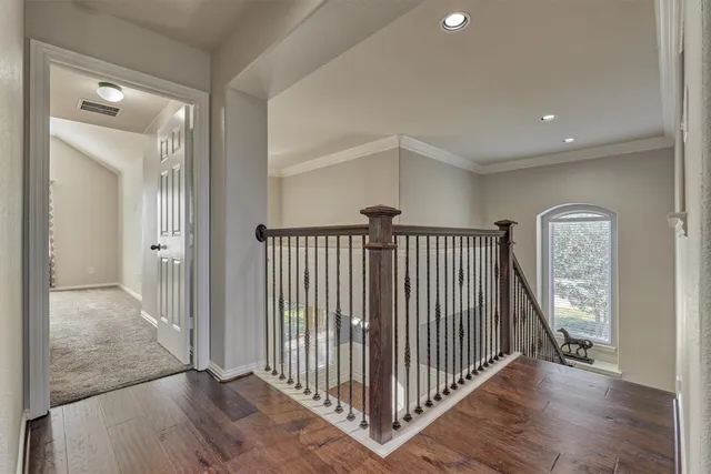 wooden floor in a hall with a window