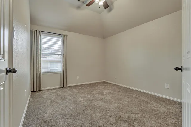 an empty room with a empty space and windows