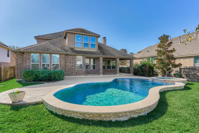 a view of a house with a swimming pool