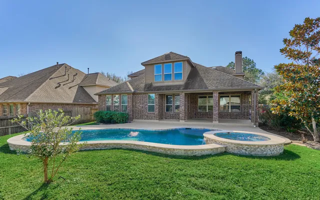 a front view of a house with a yard table and chairs