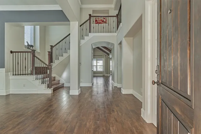 a view of entryway with wooden floor
