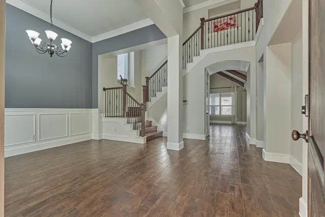a view of an entryway with wooden floor
