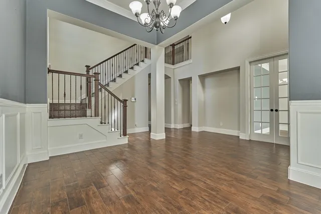 a view of an entryway with wooden floor