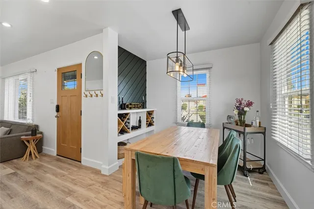 a view of a dining room with furniture window and wooden floor