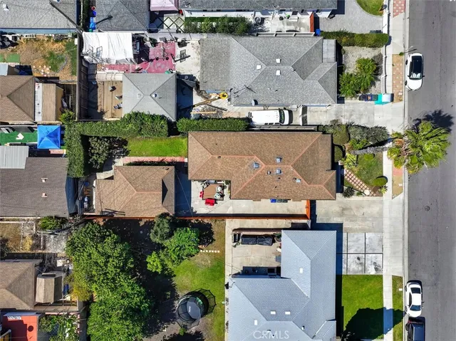 an aerial view of houses with outdoor space