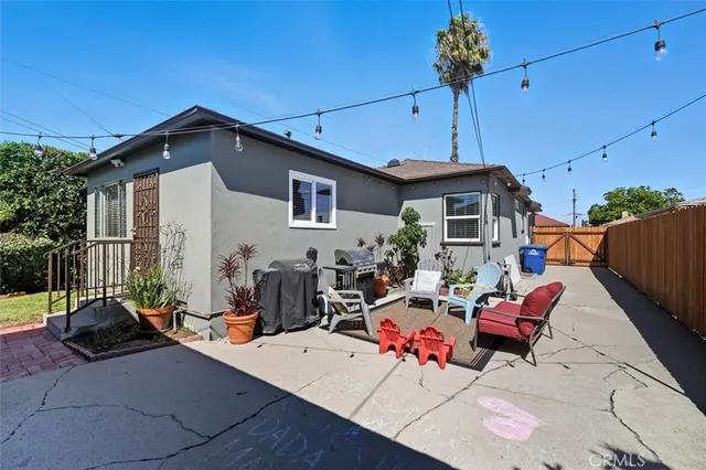 a view of a patio with a table and chairs