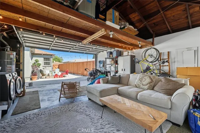 a living room with furniture a fireplace and a table