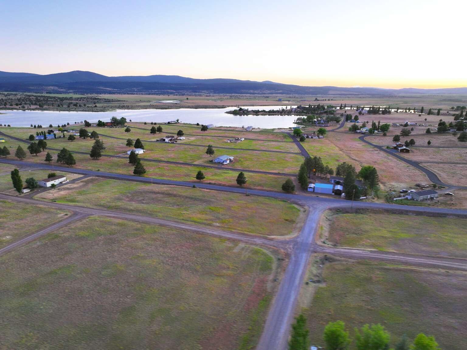 202 Starpine Road Alturas, CA 96101 - Photo 2 of 13 a view of a swimming pool and mountains in the background